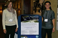 two women standing near sign